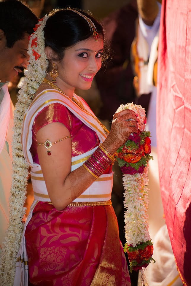 Candid Indian Wedding Bride holding garland Ravindra Joisa